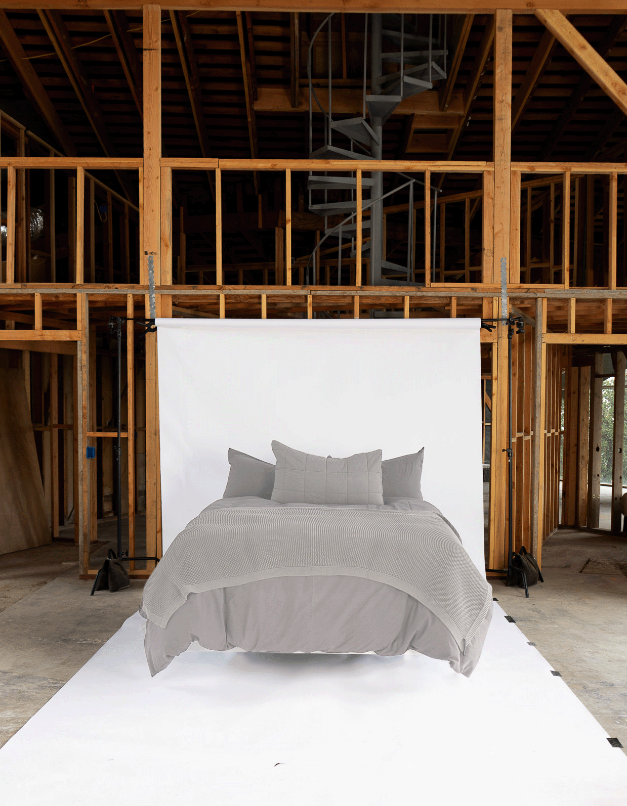 Mica Cotton Tru Duvet Cover - Styled Bed Front View, Industrial Studio Setting | MATTEO