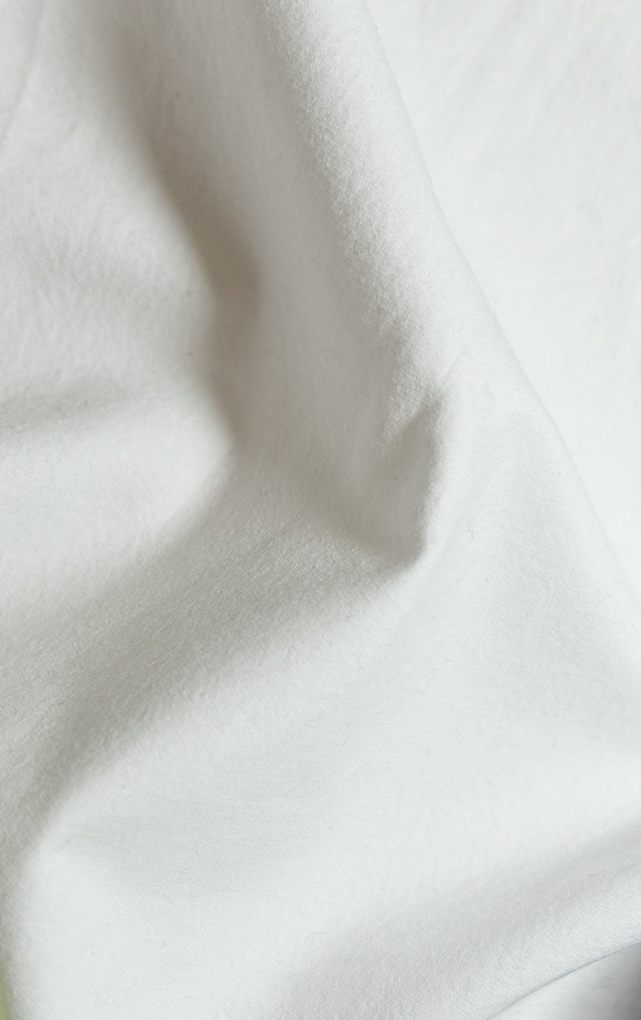 White Cotton Sateen Fabric - Close-Up Texture Detail
